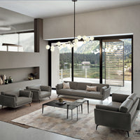 Ralph leather sofa, loveseat and two chairs placed in a room in a house beside a lake.