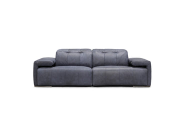 Light purple Arcadia leather sofa with power operated motion with wide seats featuring topstitching on the seat and back cushions. The armrest exterior is skillfully designed to create a break with the main structure.
