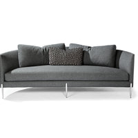 Grey Decked Out sofa with curved back and metal legs.