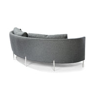 Grey Decked Out sofa with curved back and metal legs. Back view.