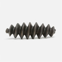 Expanding spiral concrete sculpture in antiqued bronze.