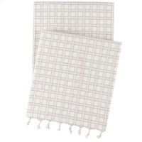 White Caldwell Plaster Throw Blanket with soft texture contrasts.