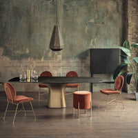 Pandora Pendant with dark brass and lacquered structure. Placed in a modern living room.