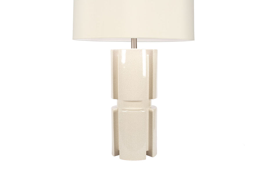 Skye table Lamp with white drum shade and cylindrical sectioned design done in ivory crackle porcelain.