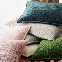 Pillows from Matte Velvet Juniper bedding Collection in various colors.