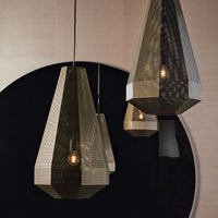 Two Pandora Pendants with dark brass and lacquered structure. Placed in front of a round mirror.