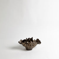 Meteor Bowl with multiple pieces cast, bound together, and fired.
