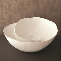 Spiral Bowl made of Portuguese ceramic with an matte white finish and a swirling ridge that spirals from the outer edges of the bowl towards the center.