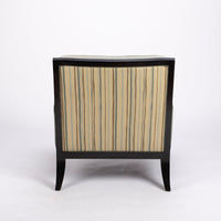 Curtis lounge chair in grey-green color with clean wood detail, softly splayed legs, and outside back framed by the wood trim, back view.