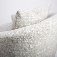A white mid sized Holly Swivel Chair with Premium down and feather cushioning and wood trim base. Closed up back view.