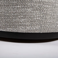 A white mid sized Holly Swivel Chair with Premium down and feather cushioning and wood trim base. Closed up bottom view.