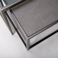 Metal nesting cocktail table consisting of glass top center table and 2 outer bunching tables, slide under the ends of the center table