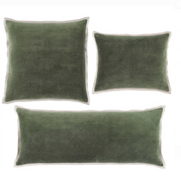 Three green Gehry Decorative Lumbar Pillows edged with a grounding natural linen flange.