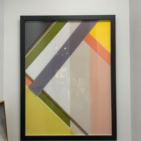 Abstract Wall Art Piece with glass and black frame.