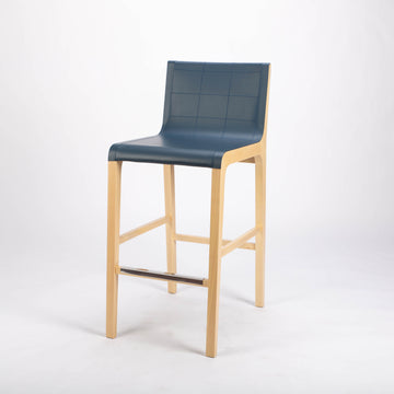Tosca Barstool with blue leather seating and solid beechwood construction. Front and side view.