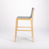 Tosca Barstool with blue leather seating and solid beechwood construction. Side view.
