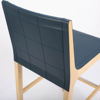 Tosca Barstool with blue leather seating and solid beechwood construction. Closed up back and side view.