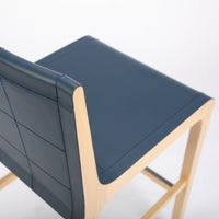 Tosca Barstool with blue leather seating and solid beechwood construction. Closed up top and side view.