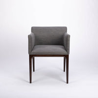 A grey four seasons dining chair crafted from solid beechwood. Front view.