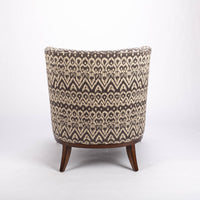 Beautifully shaped brown armless lounge chair with a curved back and seat rail, and saber shaped legs. Back view.