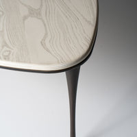 Reuleaux Large Cocktail Table with rounded, asymmetrical top and elegantly tapered legs.