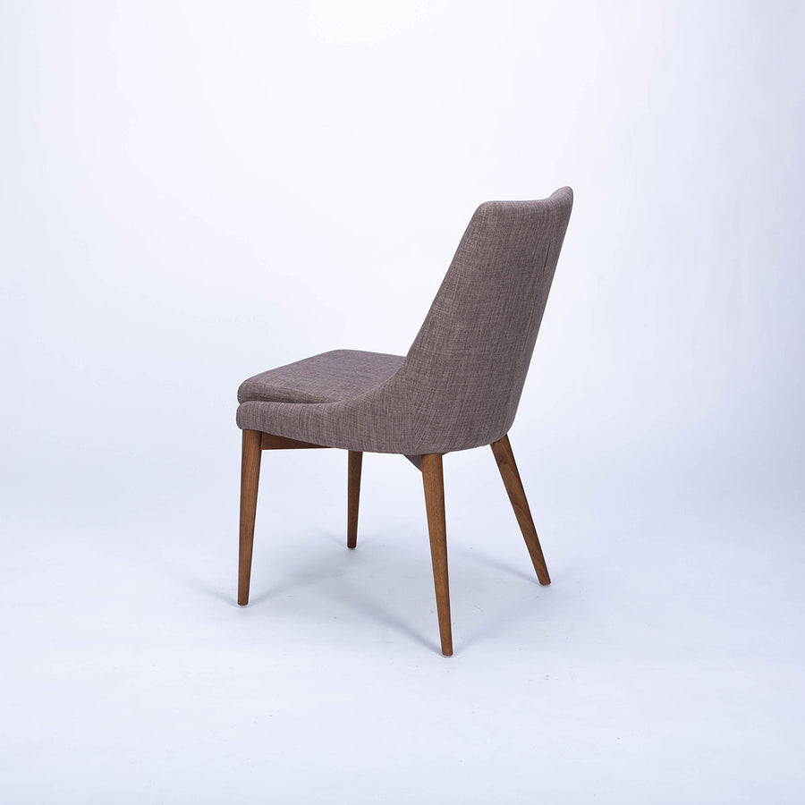 Calais Side dining chair with curved back and arms and the solid ash frame. Side and back view.