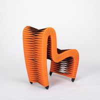 Orange and black Seat Belt dining chair with colorful seatbelt strappings, side and back view.
