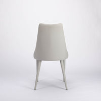Clara side dining chair completely in white color with curved back tapers and wraps, back view.