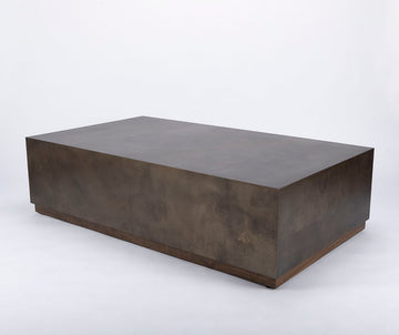 Brown Cabo Cocktail Table block shaped in an abstract metal material.
