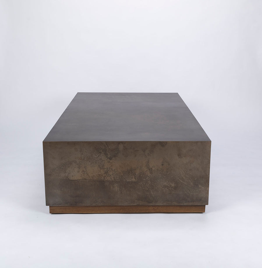 Brown Cabo Cocktail Table block shaped in an abstract metal material.