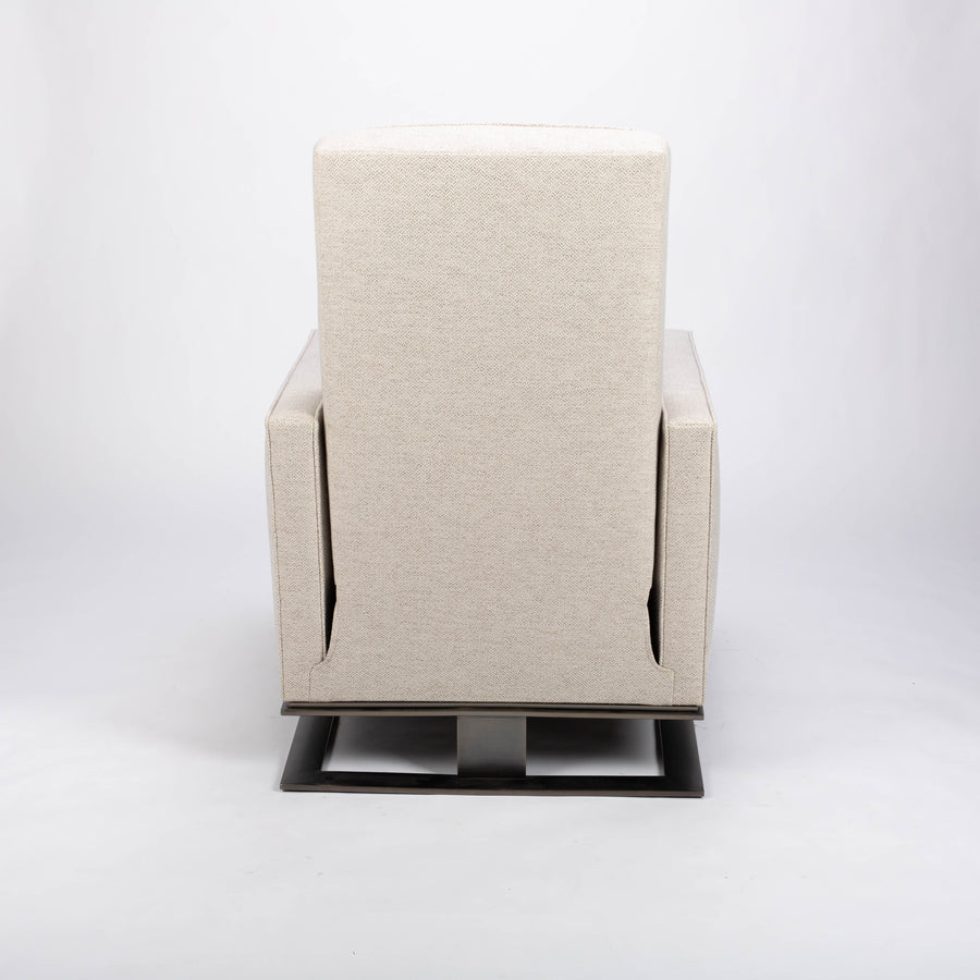 A white fabric Tate recliner lounge chair with stainless steel base, back view.