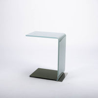 Two-toned bent glass coffee table with glued mat stainless steel plate.