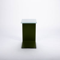 Two-toned bent glass coffee table with glued mat stainless steel plate.