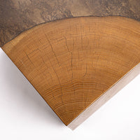 Kobe Low cube side table with wooden look made from ollection of organic designed metal and “Toasted Yukas” wood species from South America. Closed up view of the top.