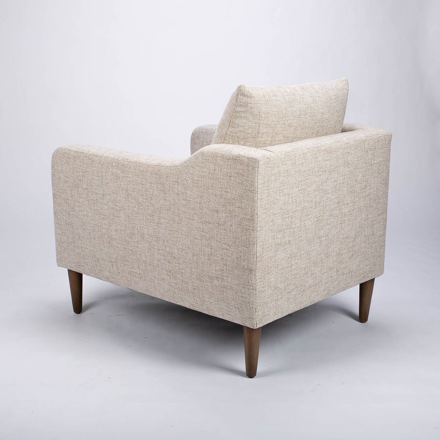 A white fabric Tea lounge stocked chair, side and back view.