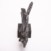 Driftwood Sculpture done in cast iron with a solid black marble base.