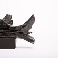 Driftwood Sculpture done in cast iron with a solid black marble base.
