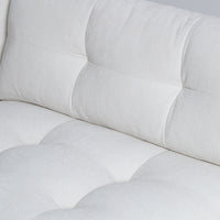 Large white u-shaped Carmet Sectional with sleek track arms. Closed up view on seat.