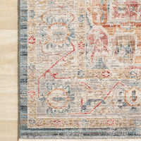 Claire Blue + Multi Area Rug power-loomed of polyester pile with a beautiful color palette and a mix of abstract and traditional-inspired motifs.