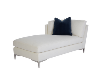 A white Aiden Chaise with metal legs and a blue pillow on it.