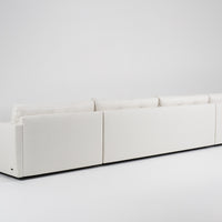 Large white u-shaped Carmet Sectional with sleek track arms. Back view.