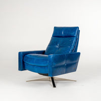 A blue leather recliner chair with four star base.