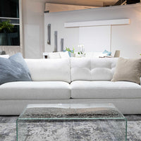 White two seat Doran sofa. placed in a furniture store.