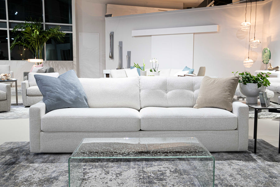 White two seat Doran sofa. placed in a furniture store.