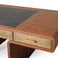 Three drawer Fonda Desk made in oiled African Walnut with a Black Vellum top panel and brass drawers, handles and feet. Closed up view on a drawer.