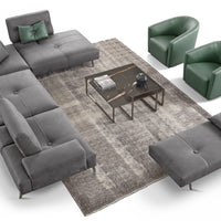 Ottoman, two green chairs, and modular leather Smart sofa with shifting mechanism which can be applied to any backrest, including the corner section. Placed in a modern living room.