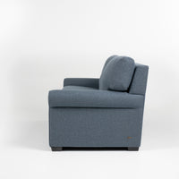 American Leather Gibbs Two Seat Standard (Queen) Comfort Sofa bed in indigo color with high tapered wood legs, left side view.