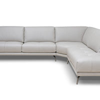 White leather Glamour sectional with a special design where the seat and backrest cushions are rested on a linear frame offering a sartorial arm detail.