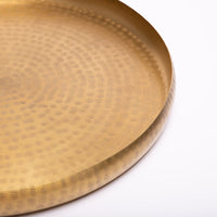 Hand-embossed brass tray.