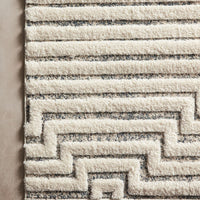 Hagen White Sky Area Rug power-loomed of 100% polypropylene pile with a tone on tone palette offset by strong, yet textural geometric patterns.